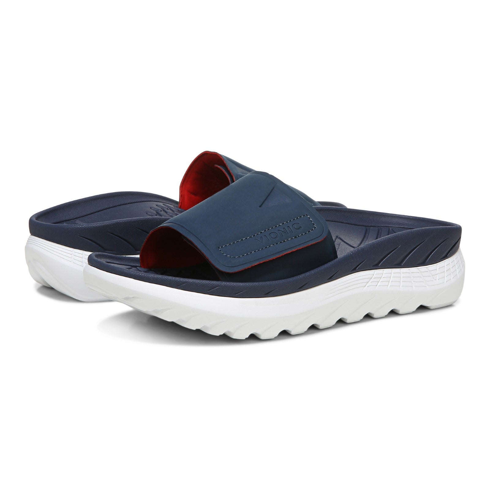 Vionic Rejuvenate Unisex Slide Sandals - Navy - pair left angle