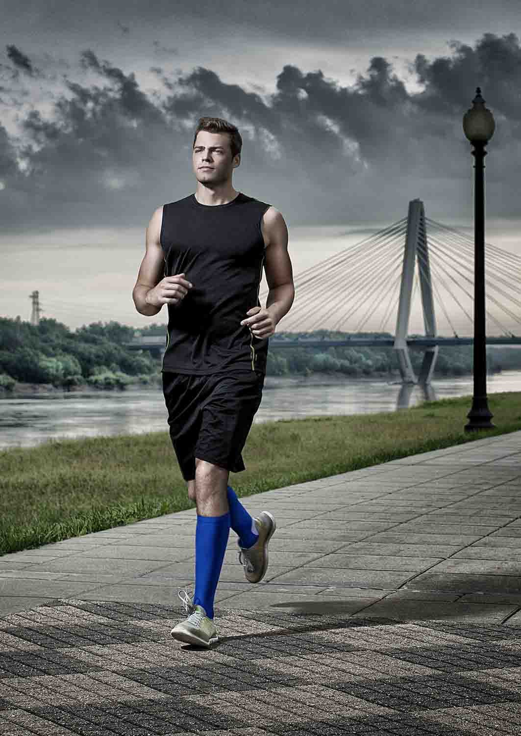 TheraSport 20-30 mmHg Athletic Performance Knee High Compression Socks - Blue - Manufacturer lifestyle view
