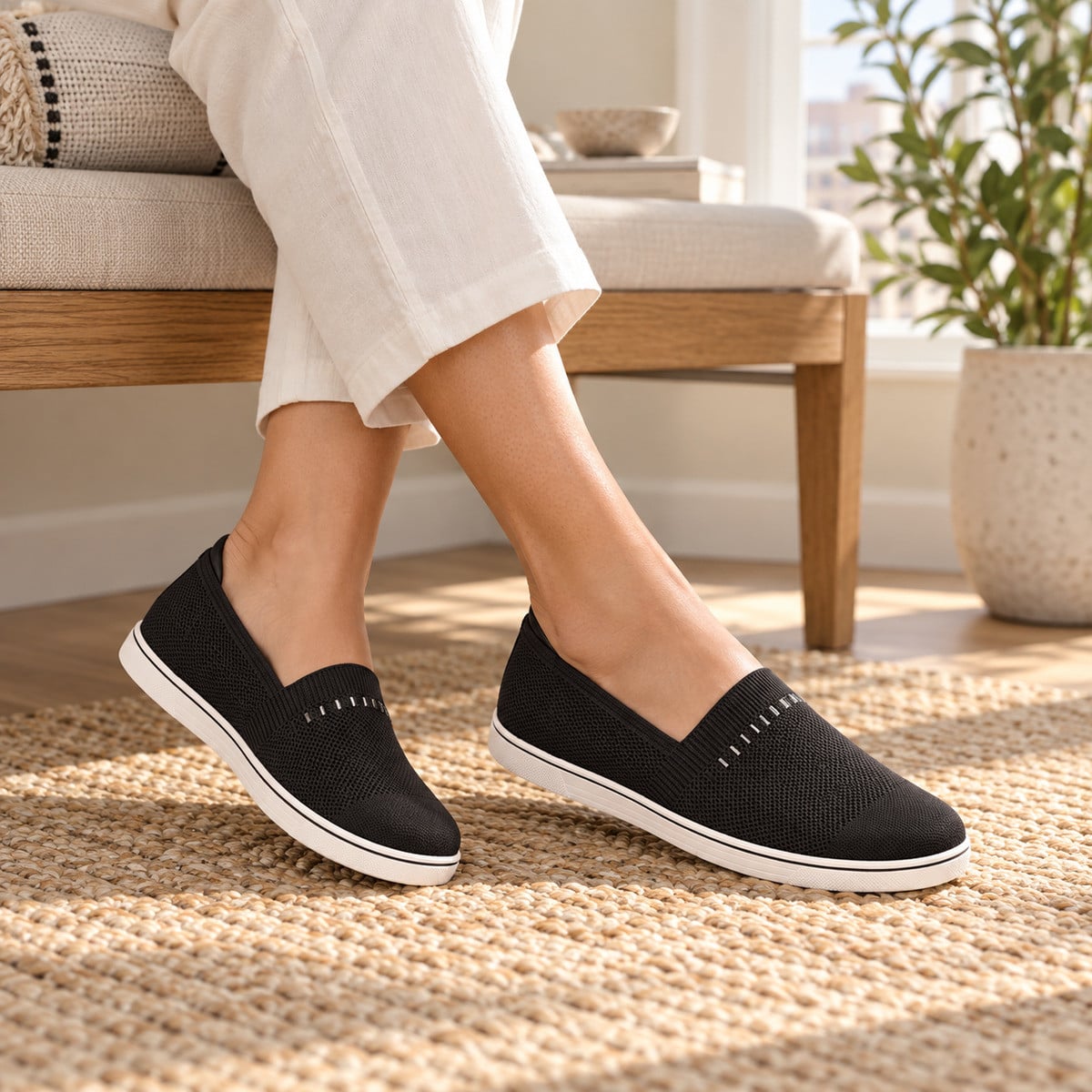 Illustrative lifestyle image: Revitalign Gemma Sparkle Black slip-on shoes worn indoors